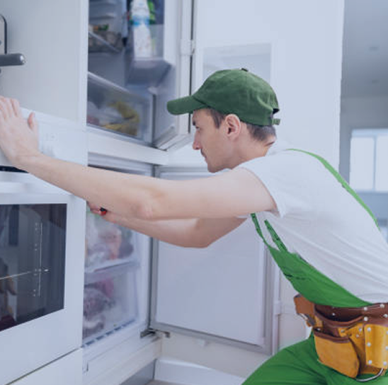 Technician repairing appliance